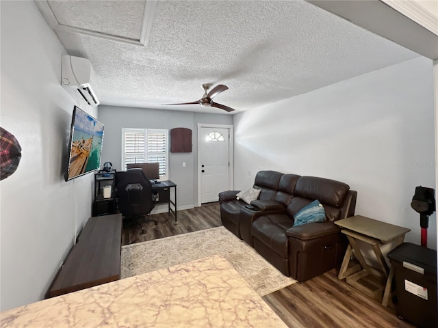 4085 SE 23rd Ter, Ocala, FL 34480 - living area with a wall mounted AC, wood finished floors, attic access, a desk, and ceiling fan
