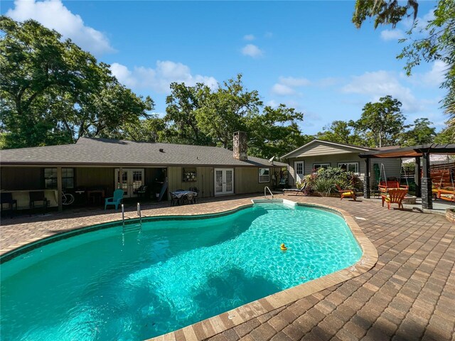 4085 SE 23rd Ter, Ocala, FL 34480 - swimming pool featuring french doors and a patio area