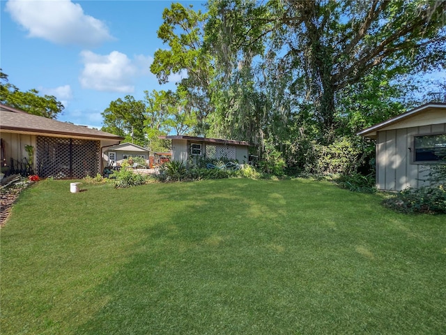 4085 SE 23rd Ter, Ocala, FL 34480 - view of green lawn featuring an outdoor structure