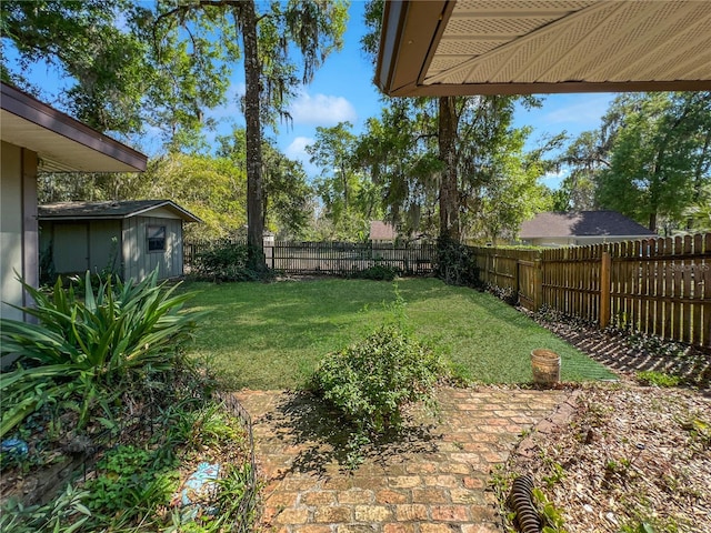4085 SE 23rd Ter, Ocala, FL 34480 - fenced backyard with an outbuilding and a patio area