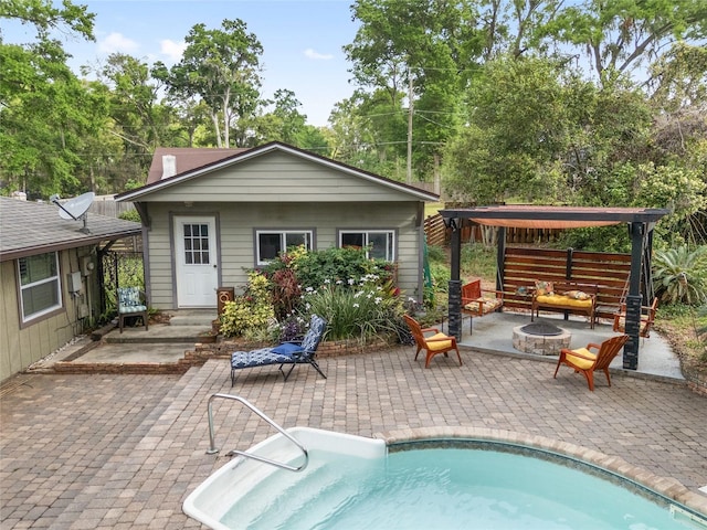 4085 SE 23rd Ter, Ocala, FL 34480 - rear view of property with an outdoor pool, a patio, an outdoor living space with a fire pit, and a gazebo