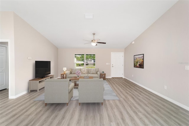 living room featuring light wood-style flooring, ceiling fan, baseboards, and lofted ceiling
