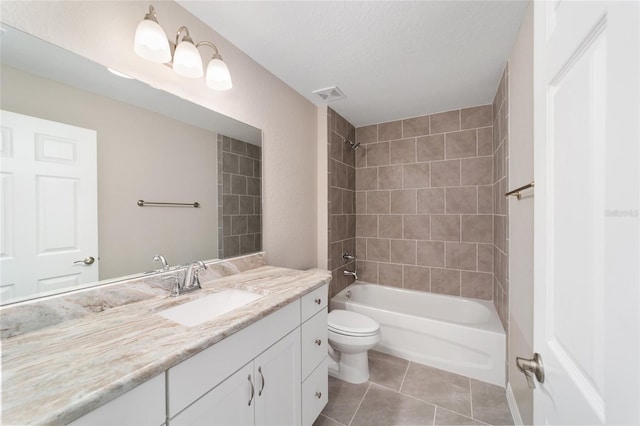 bathroom featuring vanity, bathing tub / shower combination, tile patterned floors, toilet, and visible vents