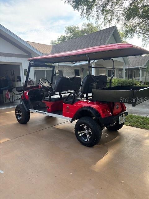 8533 SW 93rd Pl Unit A, Ocala, FL 34481 - view of vehicle parking with a carport