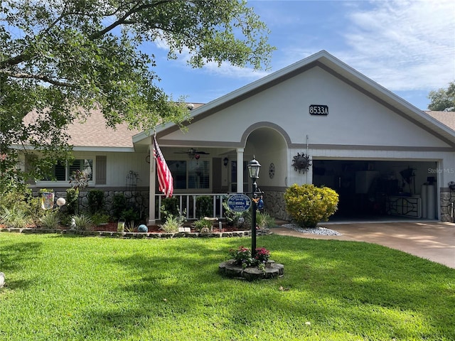 8533 SW 93rd Pl Unit A, Ocala, FL 34481 - view of front of property with stone siding, a front yard, a ceiling fan, and driveway