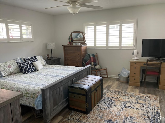8533 SW 93rd Pl Unit A, Ocala, FL 34481 - bedroom with wood finished floors, a desk, and ceiling fan