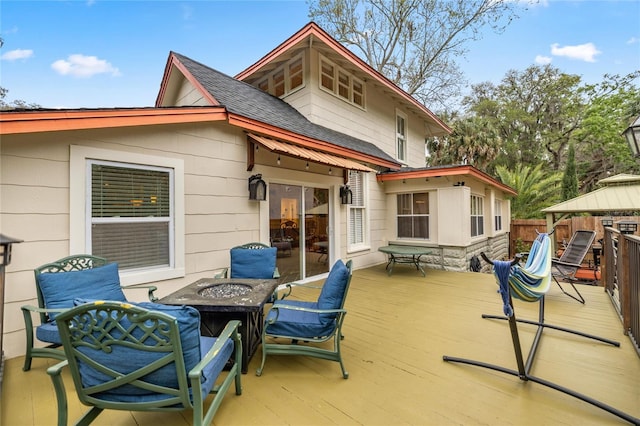 44 SE 9th Ter, Ocala, FL 34471 - back of house featuring fence, roof with shingles, a wooden deck, an outdoor fire pit, and a gazebo