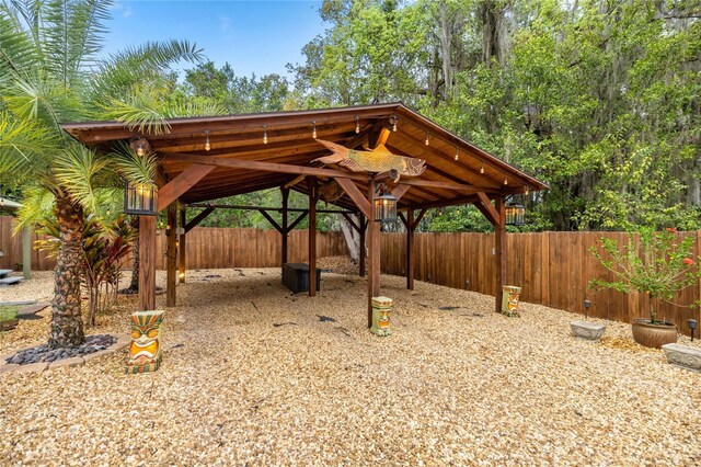44 SE 9th Ter, Ocala, FL 34471 - view of patio / terrace with fence private yard and a carport