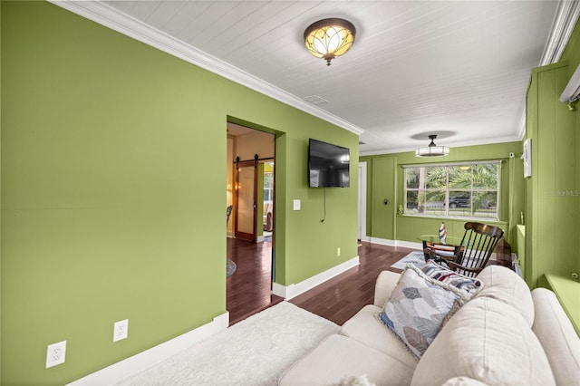 44 SE 9th Ter, Ocala, FL 34471 - living room with a barn door, ornamental molding, baseboards, and wood finished floors