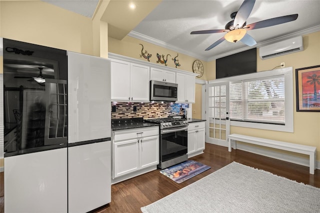 44 SE 9th Ter, Ocala, FL 34471 - kitchen with dark countertops, appliances with stainless steel finishes, a wall mounted air conditioner, and ceiling fan