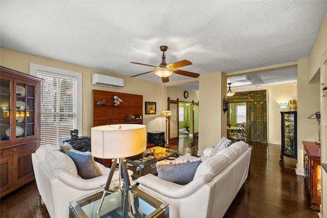 44 SE 9th Ter, Ocala, FL 34471 - living room featuring a barn door, dark wood-style floors, an AC wall unit, and ceiling fan