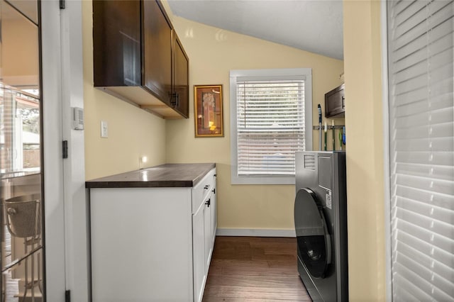 44 SE 9th Ter, Ocala, FL 34471 - laundry room with baseboards, cabinet space, dark wood-style flooring, and washer / dryer