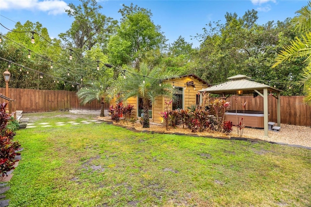 44 SE 9th Ter, Ocala, FL 34471 - view of yard with a fenced backyard, a gazebo, and a hot tub