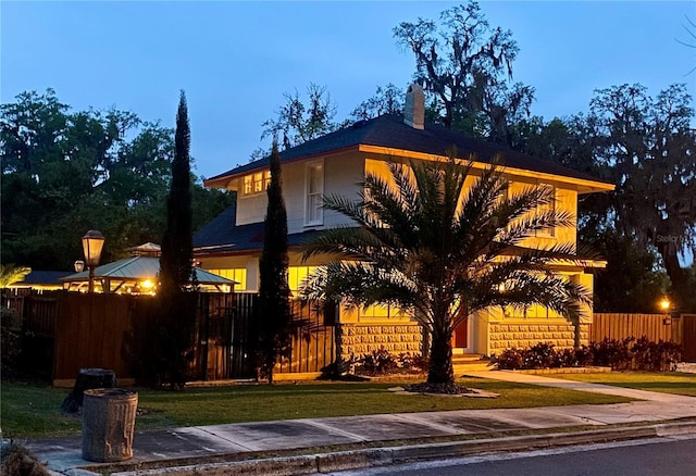 44 SE 9th Ter, Ocala, FL 34471 - view of front facade featuring a front lawn, fence, and concrete driveway