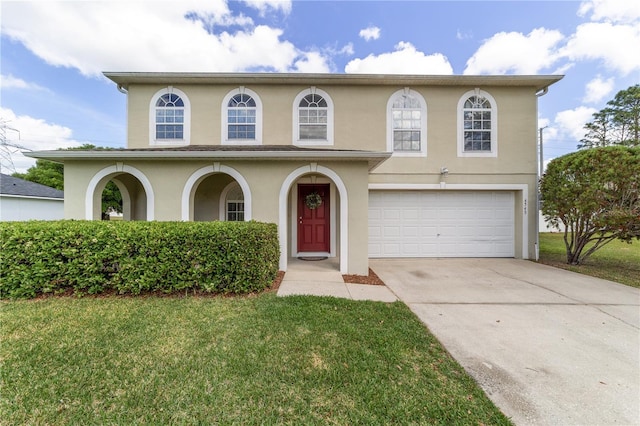 4545 SE 30th St, Ocala, FL 34480 - view of front of home with stucco siding, a garage, a front lawn, and concrete driveway