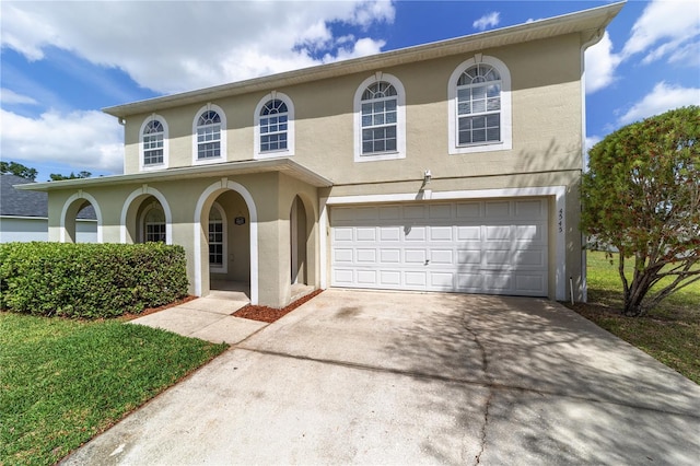 4545 SE 30th St, Ocala, FL 34480 - view of front facade featuring a garage, concrete driveway, and stucco siding