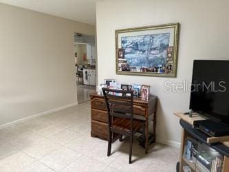8665 SW 94th St Unit C, Ocala, FL 34481 - home office featuring baseboards and light tile patterned flooring