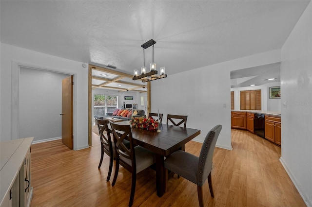 dining area with light wood-style flooring, beamed ceiling, baseboards, and a notable chandelier