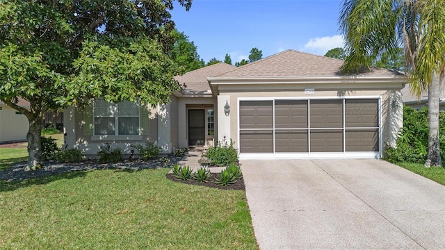 ranch-style house with an attached garage, roof with shingles, a front yard, and stucco siding