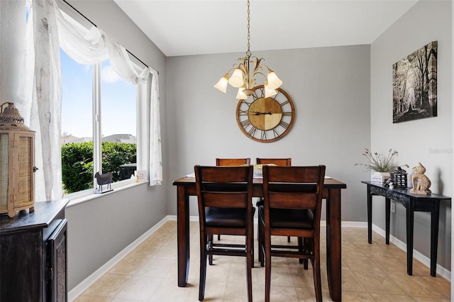 dining space featuring a chandelier, baseboards, and light tile patterned flooring