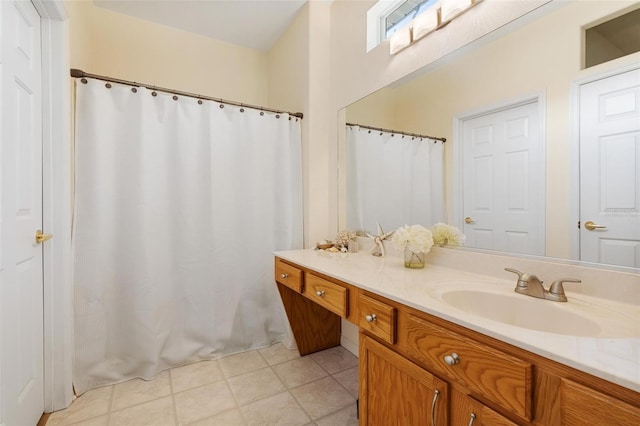 bathroom featuring tile patterned flooring and vanity