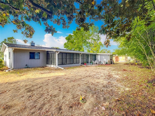 view of front of house with a sunroom