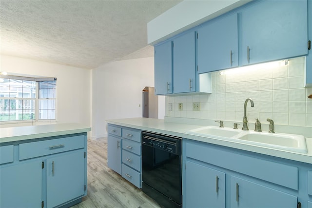 kitchen featuring backsplash, a sink, a textured ceiling, black dishwasher, and blue cabinetry