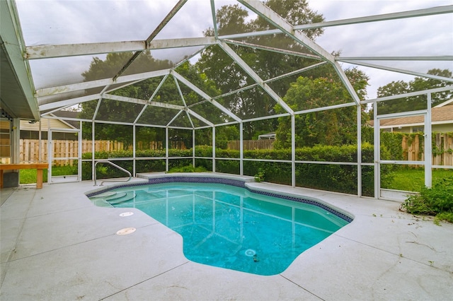 view of pool with a fenced in pool, a fenced backyard, a lanai, and a patio area