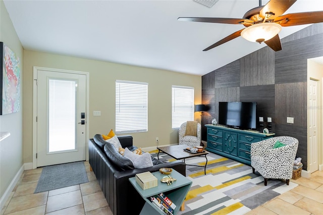 5770 SW 89th Pl, Ocala, FL 34476 - living area featuring a ceiling fan, baseboards, vaulted ceiling, and light tile patterned floors