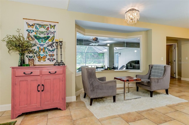 5770 SW 89th Pl, Ocala, FL 34476 - living area featuring baseboards and ceiling fan with notable chandelier