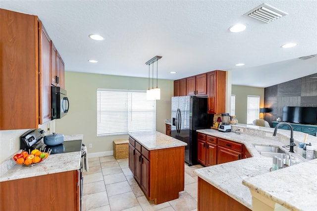 5770 SW 89th Pl, Ocala, FL 34476 - kitchen with a sink, visible vents, fridge with ice dispenser, electric range oven, and black microwave