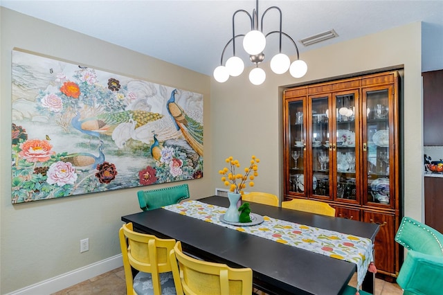 5770 SW 89th Pl, Ocala, FL 34476 - tiled dining room with baseboards, visible vents, and a chandelier