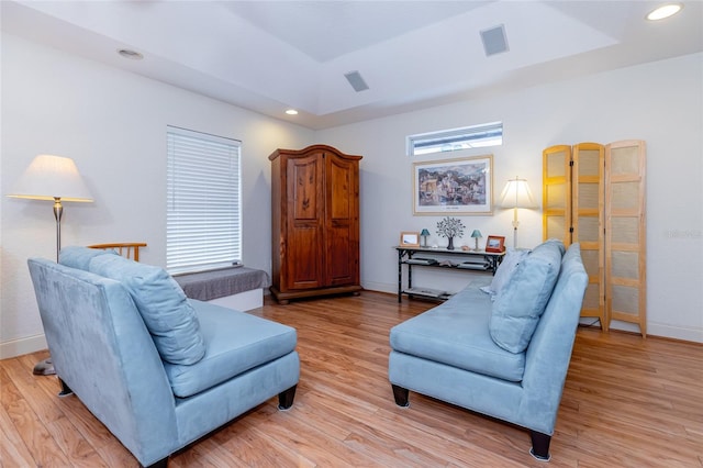 5770 SW 89th Pl, Ocala, FL 34476 - living room with a raised ceiling, recessed lighting, visible vents, and light wood-style flooring