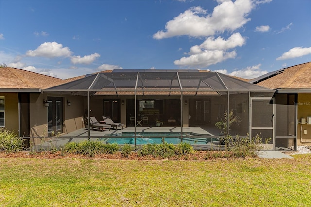 5770 SW 89th Pl, Ocala, FL 34476 - back of house featuring roof with shingles, a patio area, a yard, an outdoor pool, and stucco siding