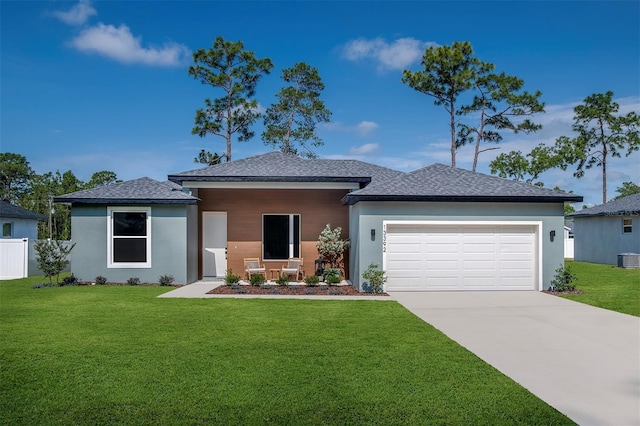 11555 SW 59th Ter, Ocala, FL 34476 - view of front of house featuring an attached garage, driveway, and stucco siding