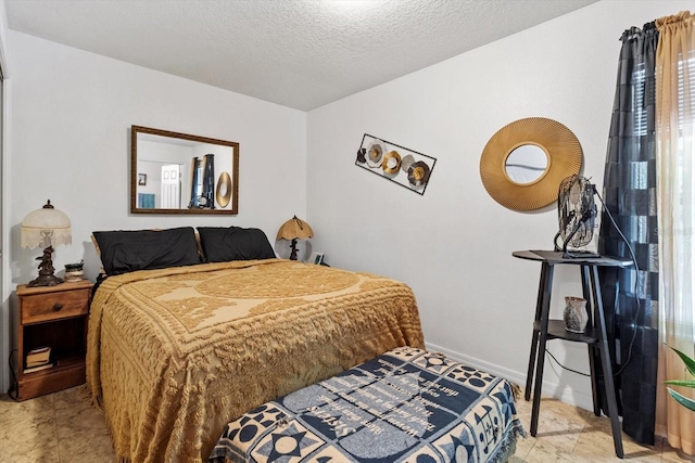 8570 N Discalfani Loop, Crystal River, FL 34428 - bedroom featuring baseboards and a textured ceiling