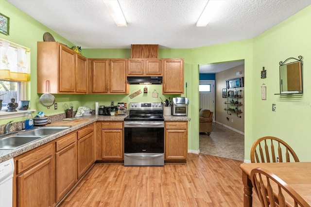 8570 N Discalfani Loop, Crystal River, FL 34428 - kitchen with light countertops, a sink, dishwasher, under cabinet range hood, and electric range