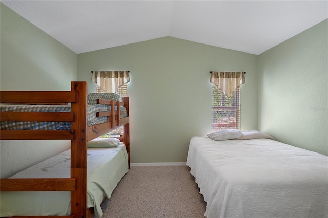 6 Statice Ct, Homosassa, FL 34446 - carpeted bedroom featuring lofted ceiling, baseboards, and multiple windows