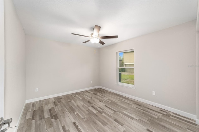 unfurnished room featuring baseboards, ceiling fan, and light wood-style flooring