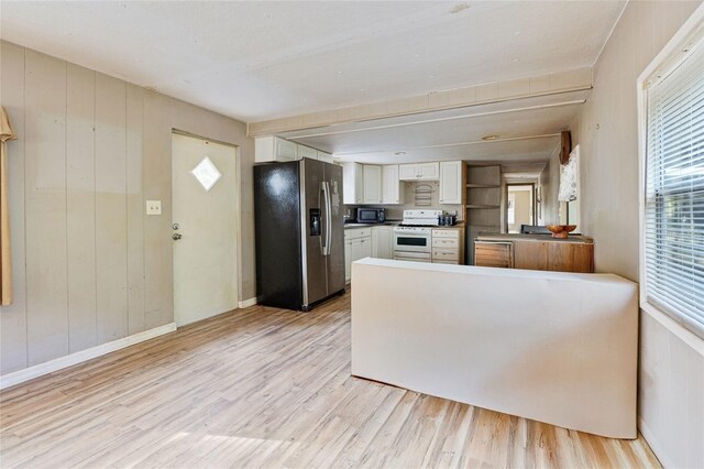 2780 County Road 575, Bushnell, FL 33513 - kitchen featuring white cabinetry, white range oven, stainless steel refrigerator with ice dispenser, and light wood-type flooring