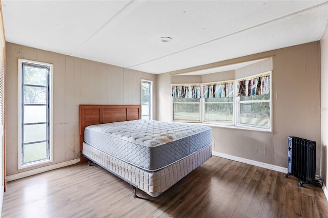 2780 County Road 575, Bushnell, FL 33513 - bedroom with radiator heating unit, baseboards, and wood finished floors