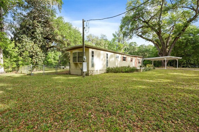 2780 County Road 575, Bushnell, FL 33513 - view of yard with fence and a detached carport