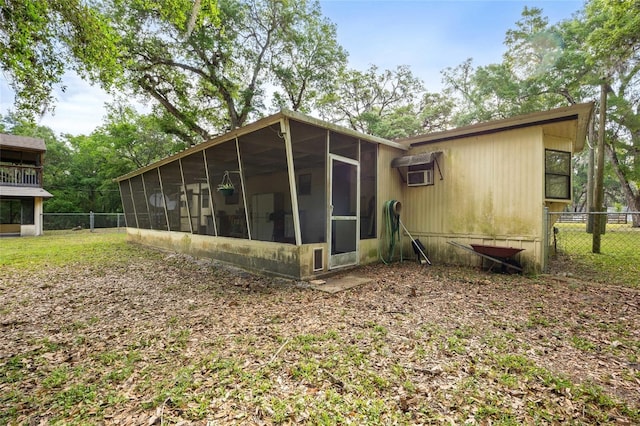 2780 County Road 575, Bushnell, FL 33513 - back of house featuring a sunroom and fence