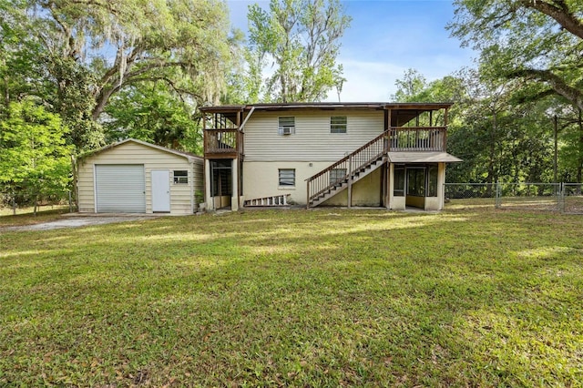 2780 County Road 575, Bushnell, FL 33513 - back of property with fence, stairs, a detached garage, an outbuilding, and a yard