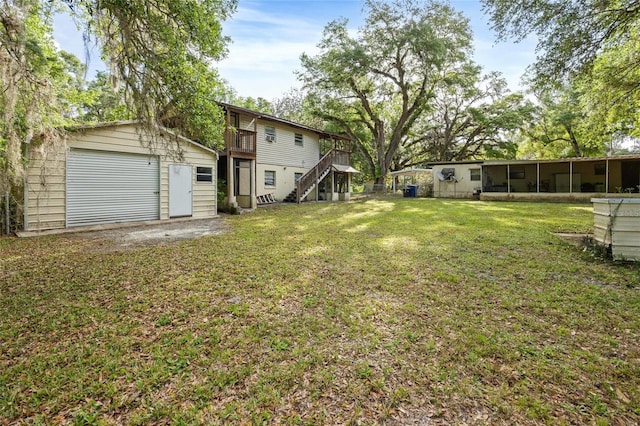 2780 County Road 575, Bushnell, FL 33513 - view of yard featuring an outdoor structure, stairway, a deck, and a detached garage