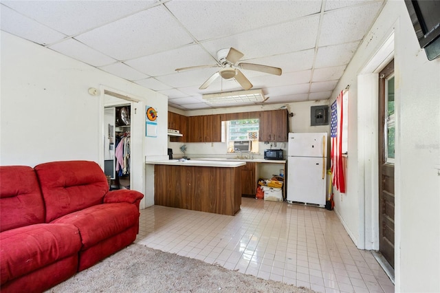 2780 County Road 575, Bushnell, FL 33513 - kitchen featuring light countertops, freestanding refrigerator, open floor plan, ceiling fan, and a paneled ceiling