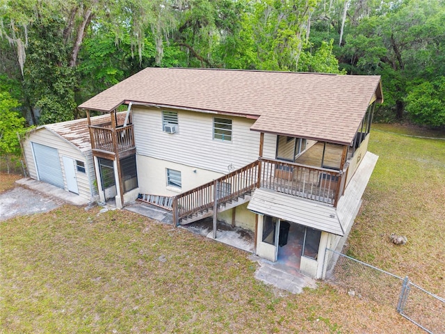 2780 County Road 575, Bushnell, FL 33513 - back of property with an outdoor structure, fence, a shingled roof, and a yard