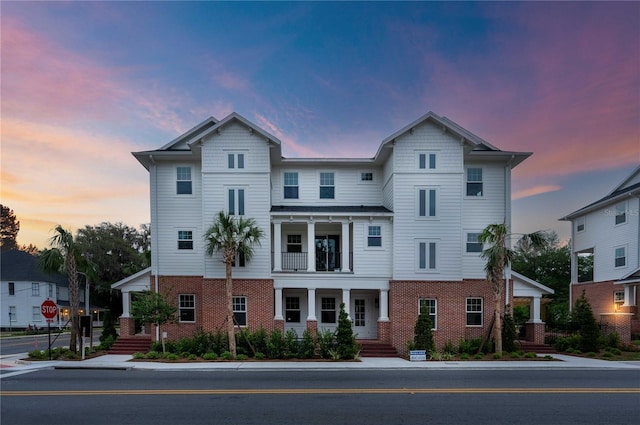 129 SE Watula Ave, Ocala, FL 34471 - view of front of property with brick siding and a balcony