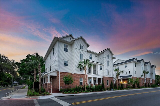 129 SE Watula Ave, Ocala, FL 34471 - view of front facade featuring brick siding