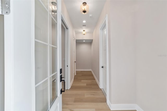 129 SE Watula Ave, Ocala, FL 34471 - hallway with baseboards, light wood finished floors, and recessed lighting